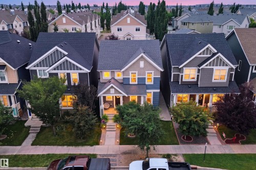 Exterior featuring a prominent front porch, gabled rooflines, and a well-maintained walkway - 7603 Summerside Grande Boulevard Sw, Edmonton, AB - Outdoor With Facade