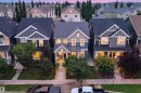 Exterior featuring a prominent front porch, gabled rooflines, and a well-maintained walkway - 7603 Summerside Grande Boulevard Sw, Edmonton, AB  - Outdoor With Facade 