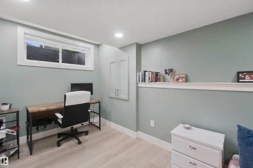 Recessed lighting, wood-finish flooring, built-in wall shelving, and built-in cabinetry - 7603 Summerside Grande Boulevard Sw, Edmonton, AB - Indoor