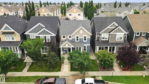 Two-story exterior with a gabled roof and siding, featuring a covered front porch and a paved walkway - 7603 Summerside Grande Boulevard Sw, Edmonton, AB -  With Facade