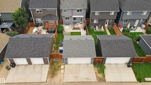 Detached garage with dual overhead doors - 7603 Summerside Grande Boulevard Sw, Edmonton, AB - Outdoor With Deck Patio Veranda With Exterior