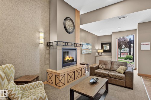 #1102 10319 111 St Nw, Edmonton, AB - Indoor Photo Showing Living Room With Fireplace