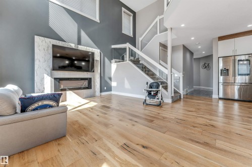 704 172 St Sw, Edmonton, AB - Indoor Photo Showing Living Room With Fireplace