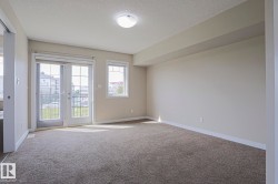 Wall-to-wall carpeting, white trim, and a flush mount ceiling light - 