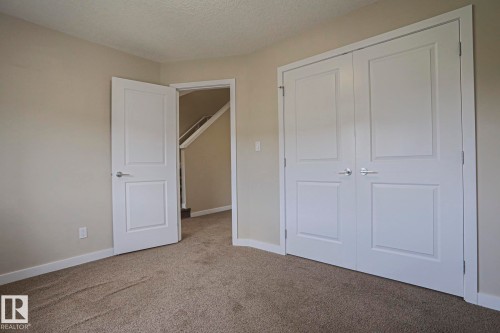 Warm neutral wall color with white trim - #13 5873 Mullen Pl Nw, Edmonton, AB - Indoor