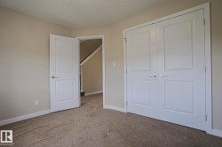 Warm neutral wall color with white trim - 