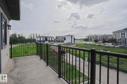 Concrete balcony with black metal railings - 