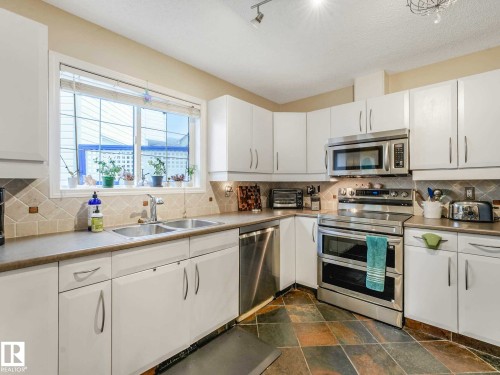 4031 38 Street Nw, Edmonton, AB - Indoor Photo Showing Kitchen With Stainless Steel Kitchen With Double Sink