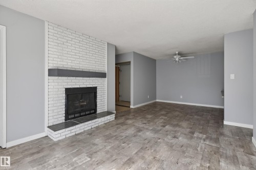 #304 24 Alpine Pl, St. Albert, AB - Indoor Photo Showing Living Room With Fireplace