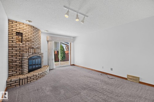 5814 181 Street Nw, Edmonton, AB - Indoor Photo Showing Other Room With Fireplace