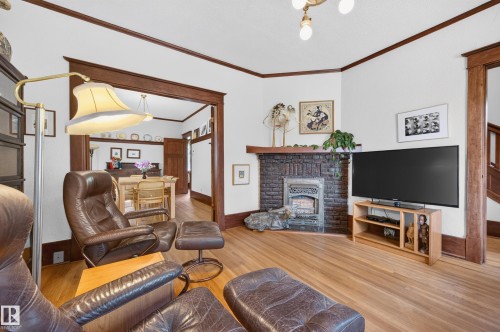 9662 85 Avenue Nw, Edmonton, AB - Indoor Photo Showing Living Room With Fireplace