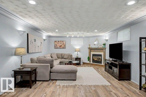 12112 38 Street Nw, Edmonton, AB - Indoor Photo Showing Living Room With Fireplace