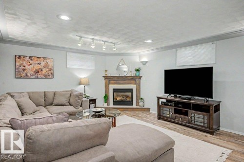 12112 38 Street Nw, Edmonton, AB - Indoor Photo Showing Living Room With Fireplace