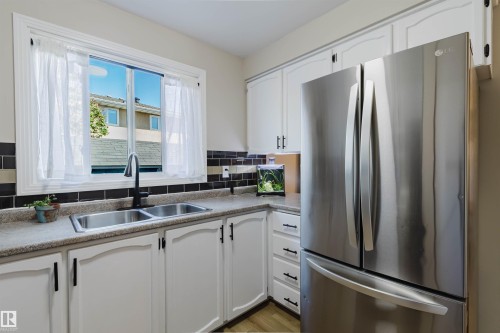 10946 Beaumaris Road Nw, Edmonton, AB - Indoor Photo Showing Kitchen With Stainless Steel Kitchen With Double Sink