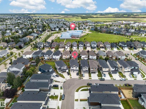 Aerial neighborhood perspective featuring residential properties with asphalt shingle roofs - 3217 Pelerin Crescent, Beaumont, AB - Outdoor With View