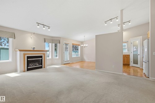 #10 9 Dechene Rd Nw, Edmonton, AB - Indoor Photo Showing Other Room With Fireplace