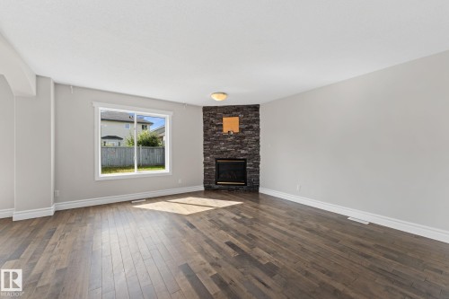 173 Castle Drive Nw, Edmonton, AB - Indoor Photo Showing Living Room With Fireplace