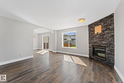 173 Castle Drive Nw, Edmonton, AB - Indoor Photo Showing Living Room With Fireplace