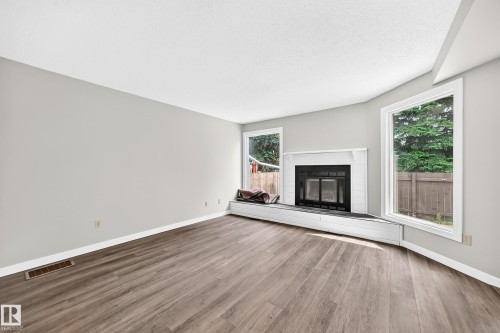 #6 1820 56 St Nw, Edmonton, AB - Indoor Photo Showing Living Room With Fireplace
