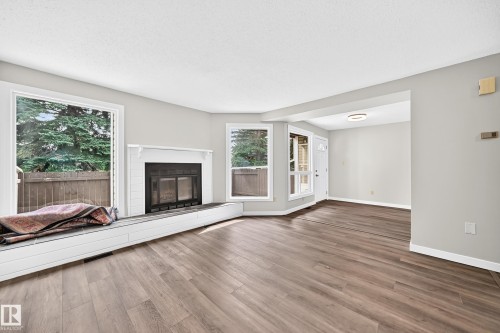 #6 1820 56 St Nw, Edmonton, AB - Indoor Photo Showing Living Room With Fireplace