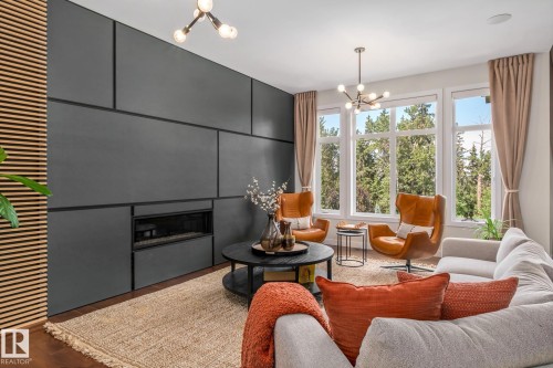 699 Howatt Drive Sw, Edmonton, AB - Indoor Photo Showing Living Room With Fireplace