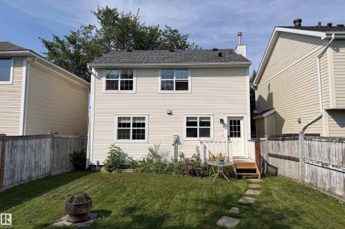 Two-story exterior with horizontal siding and a dark shingle roof - 115 Griesbach Road Nw, Edmonton, AB - Outdoor With Exterior