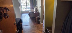 Wood-finish flooring throughout, with a neutral wall palette - 