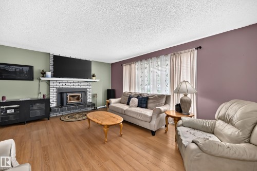 9205 84 Street, Fort Saskatchewan, AB - Indoor Photo Showing Living Room With Fireplace