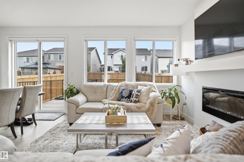 3877 Chrustawka Place Sw, Edmonton, AB - Indoor Photo Showing Living Room With Fireplace