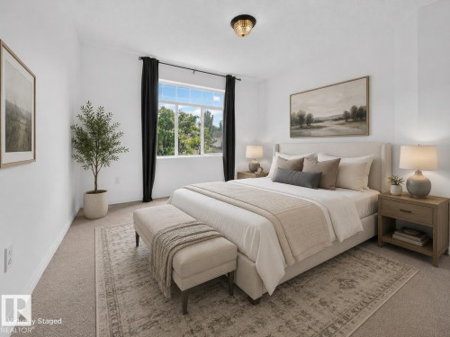 Recessed window with dark drapery panels, light-colored walls, and a semi-flush mount ceiling light - #47 30 Levasseur Rd, St. Albert, AB - Indoor Photo Showing Bedroom