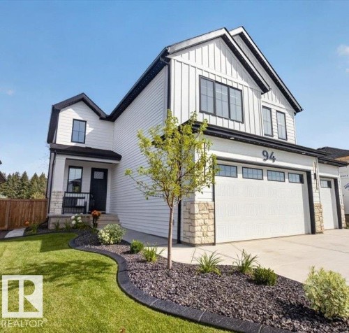 Contemporary exterior featuring white siding and black trim - 94 Harvest Crescent, Ardrossan, AB - Outdoor
