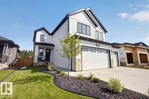 Contemporary exterior featuring white siding and black trim - 94 Harvest Crescent, Ardrossan, AB - Outdoor