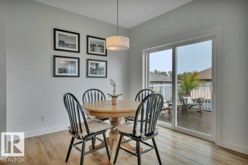 Overlooking deck with BBQ (included) - 5329 Lark Landing Nw, Edmonton, AB - Indoor Photo Showing Dining Room