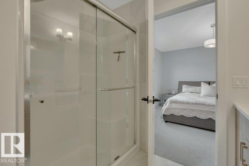 Looking to primary bedroom - 5329 Lark Landing Nw, Edmonton, AB - Indoor Photo Showing Bathroom