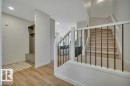 Metal spindle railings leading to 2nd floor - 5329 Lark Landing Nw, Edmonton, AB  - Indoor Photo Showing Other Room 
