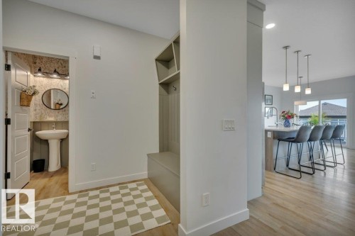 Looking to mudroom area and 2-pc powder room - 5329 Lark Landing Nw, Edmonton, AB - Indoor Photo Showing Other Room