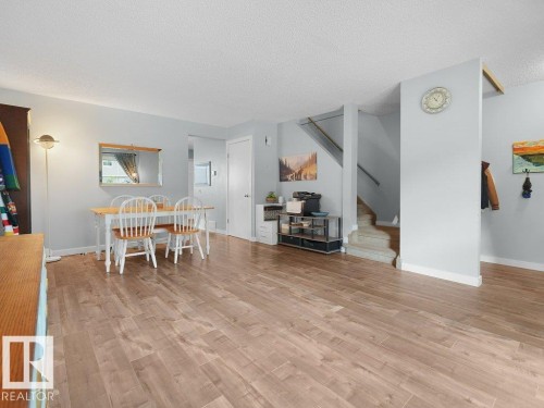 Wood-finish flooring throughout, light gray wall tones, and recessed lighting - #54 2131 Oak St, Sherwood Park, AB - Indoor
