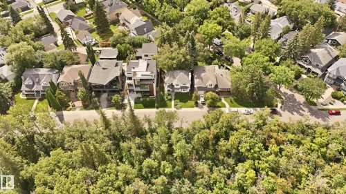 Residential street lined with mature trees and diverse architectural styles - 14631 Summit Drive Nw, Edmonton, AB 