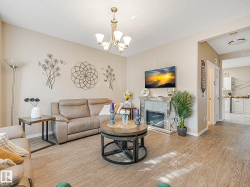 #48 1780 Glastonbury Bv Nw, Edmonton, AB - Indoor Photo Showing Living Room With Fireplace