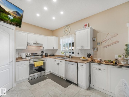 #48 1780 Glastonbury Bv Nw, Edmonton, AB - Indoor Photo Showing Kitchen With Double Sink