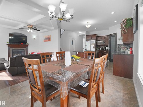 16903 54 Street Nw, Edmonton, AB - Indoor Photo Showing Dining Room With Fireplace