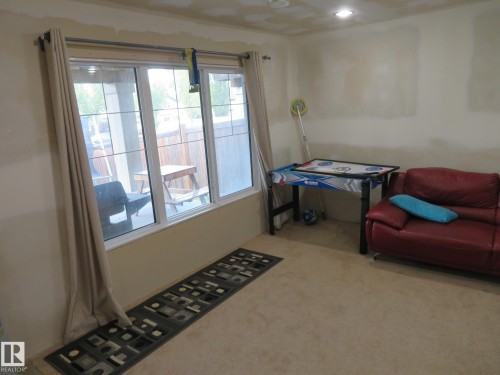 Triple-pane window with white framing - 3233 Winspear Crescent Sw, Edmonton, AB - Indoor Photo Showing Other Room