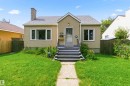 Stucco exterior residence with a gabled roofline and an exterior chimney - 11710 94 Street Nw, Edmonton, AB  - Outdoor 