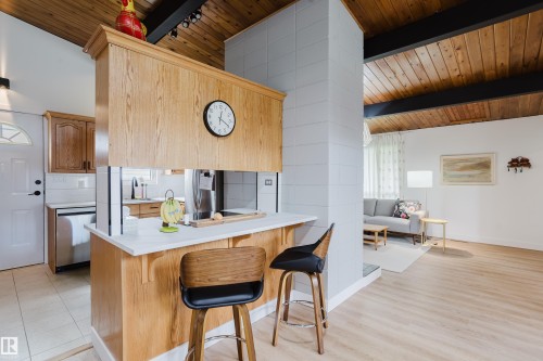 Vaulted wood-paneled ceiling with exposed beams - 9059 52 Street Nw, Edmonton, AB - Indoor