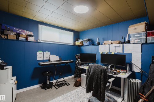 Room featuring paneling, a drop ceiling, and an upper window - 9059 52 Street Nw, Edmonton, AB - Indoor Photo Showing Office