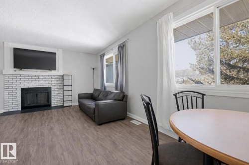 #302 6204 180 St Nw, Edmonton, AB - Indoor Photo Showing Living Room With Fireplace