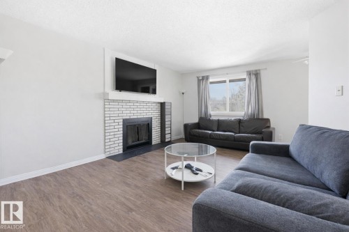 #302 6204 180 St Nw, Edmonton, AB - Indoor Photo Showing Living Room With Fireplace