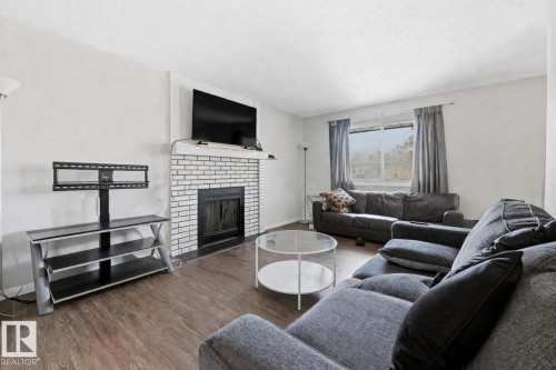 #302 6204 180 St Nw, Edmonton, AB - Indoor Photo Showing Living Room With Fireplace