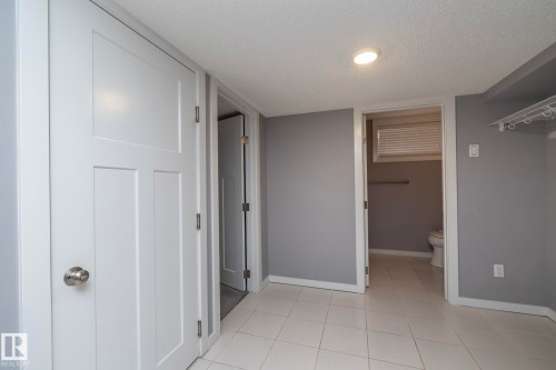 White tile flooring complemented by light gray walls - 11138 30 Avenue Nw, Edmonton, AB - Indoor Photo Showing Other Room