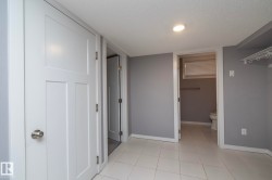 White tile flooring complemented by light gray walls - 